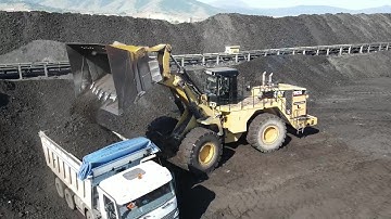 Aerial View Of Caterpillar 992G Wheel Loader Loading Coal On Trucks - Sotiriadis/Labrianidis Mining