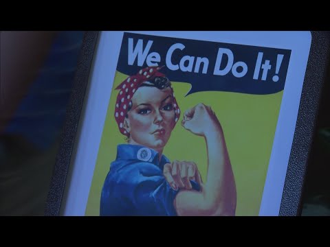 Video: Koks smeigtukas ant Rosie the Riveters apykaklės?