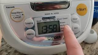 Changing modes. Make sure it's plugged in Tiger 5.5-Cup Micom Rice Cooker and Warmer from Costco.