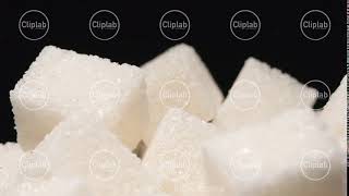SLOW MOTION: Macro shot of falling of sugar cube on a heap