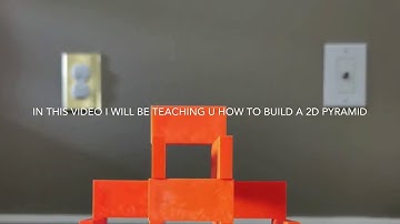 How to build a 2D domino pyramid