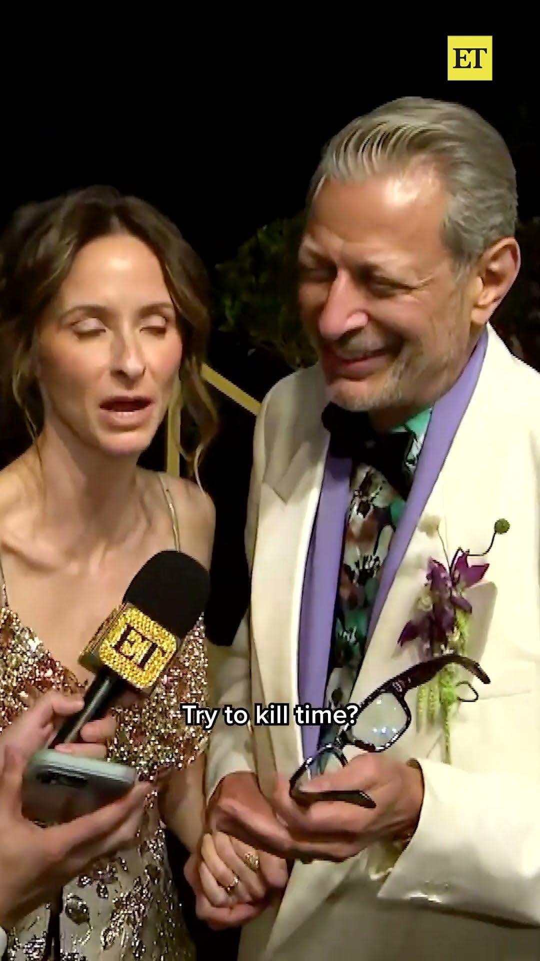 Jeff Goldblum reacts to getting caught looking at his own red carpet photos. (Carlos Barria/Reuters)