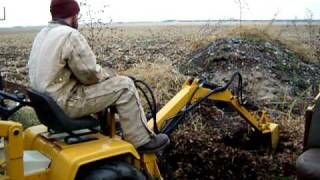 cub cadet backhoe in action