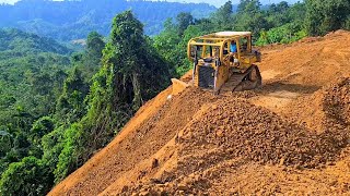 The Bulldozer CAT D6R XL Cutting Hill and Leveling Land For Plantation Road Construction