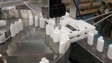 Empty Oval Bottles On A Garvey Rotary Table Accumulator
