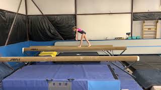 Needle kick walks on beam