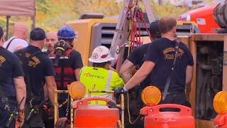 Rescuers search for trapped contractors in Downers Grove storm drain