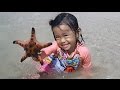 Baby playing star fish and beach sand  donna the explorer