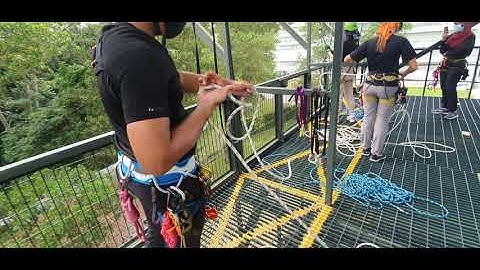 Setting up a fixed abseil system.