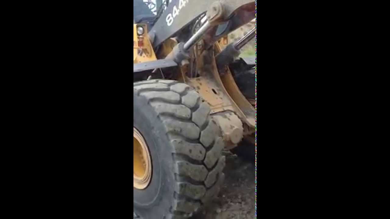 John Deere 844K loading dump truck