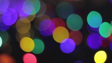 Abstract colorful background with motion defocused bokeh lights Free HD Video Footage Motion Graphic