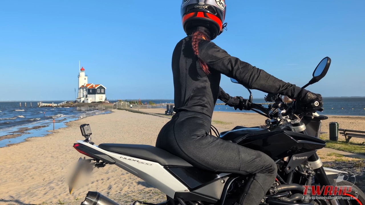 A scenic ride on the Nuda 900 through iconic Netherlands with water, windmills and green fields