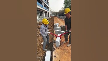 Granite paving process along the road- Good tools and machinery make work easy