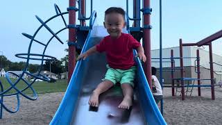 Two year old going down the slide