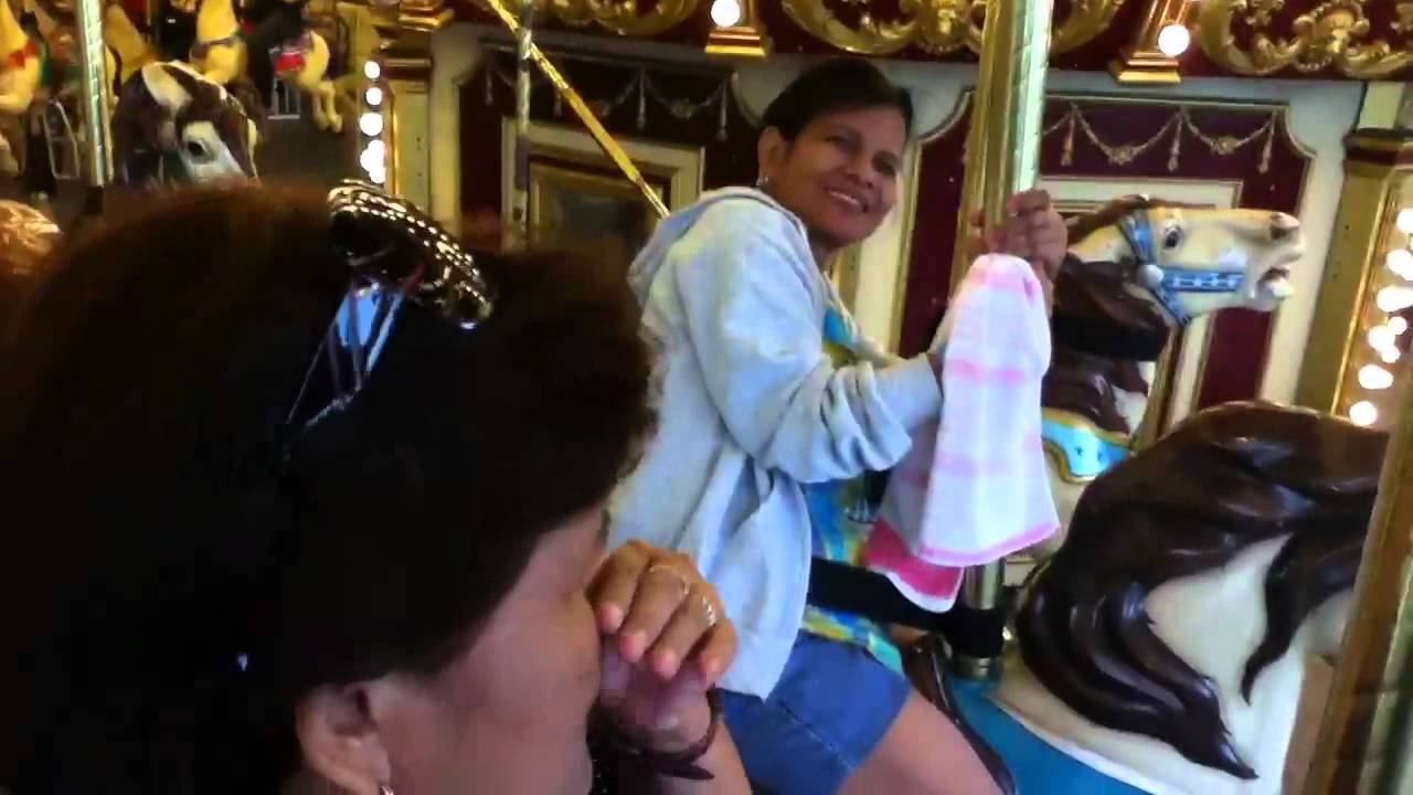 The PTG at Enchanted Kingdom riding the Carousel