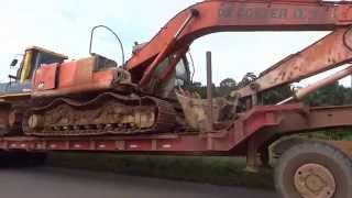 Transporting a Komatsu D65PX and a Hitachi Zaxis 250LC with the M1070
