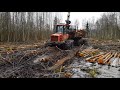 Valmet 840.2 forwarder logging in wet forest.