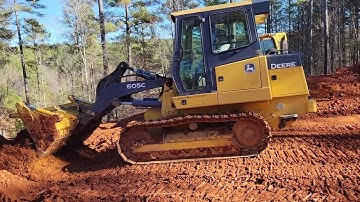 New John Deere 605c Grading a house seat on a Mountainside lot in western NC. #HighCountryTimber