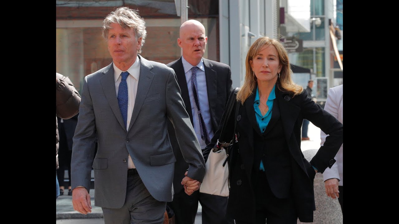 Felicity Huffman arrives for court in Boston newspaper mockup