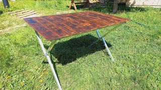 Chic and simple folding table made of clapboard scraps for picnics and outdoor recreation