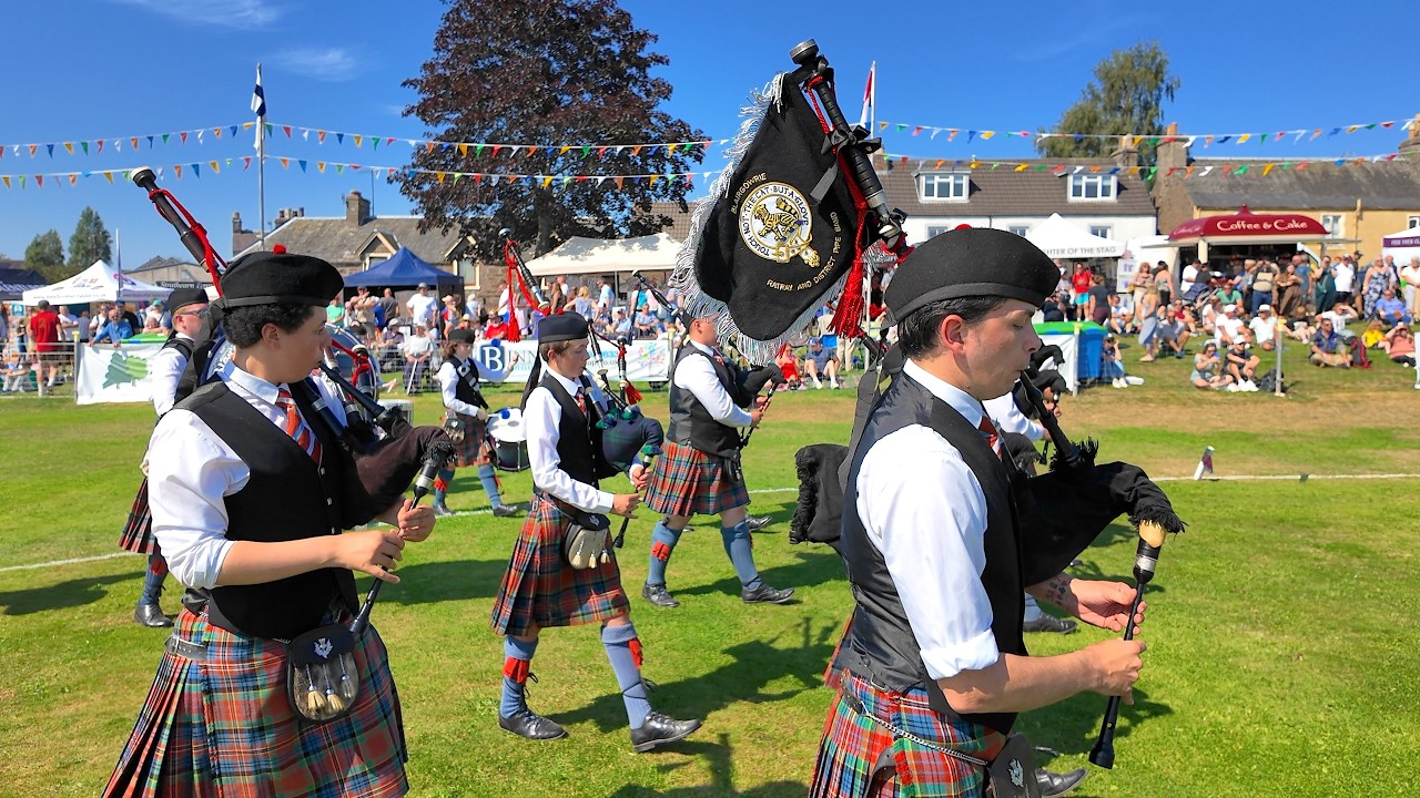 Blairgowrie Pipe Band march in playing Port Askaig at 2025 Crieff Highland Gathering in Scotland