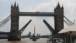 Tower Bridge London opening and closing to let a tall boat and ourselves through, City cruise London