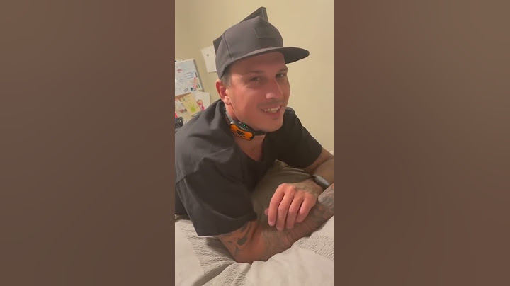 Man tries on the bark collar before using it on their dog...