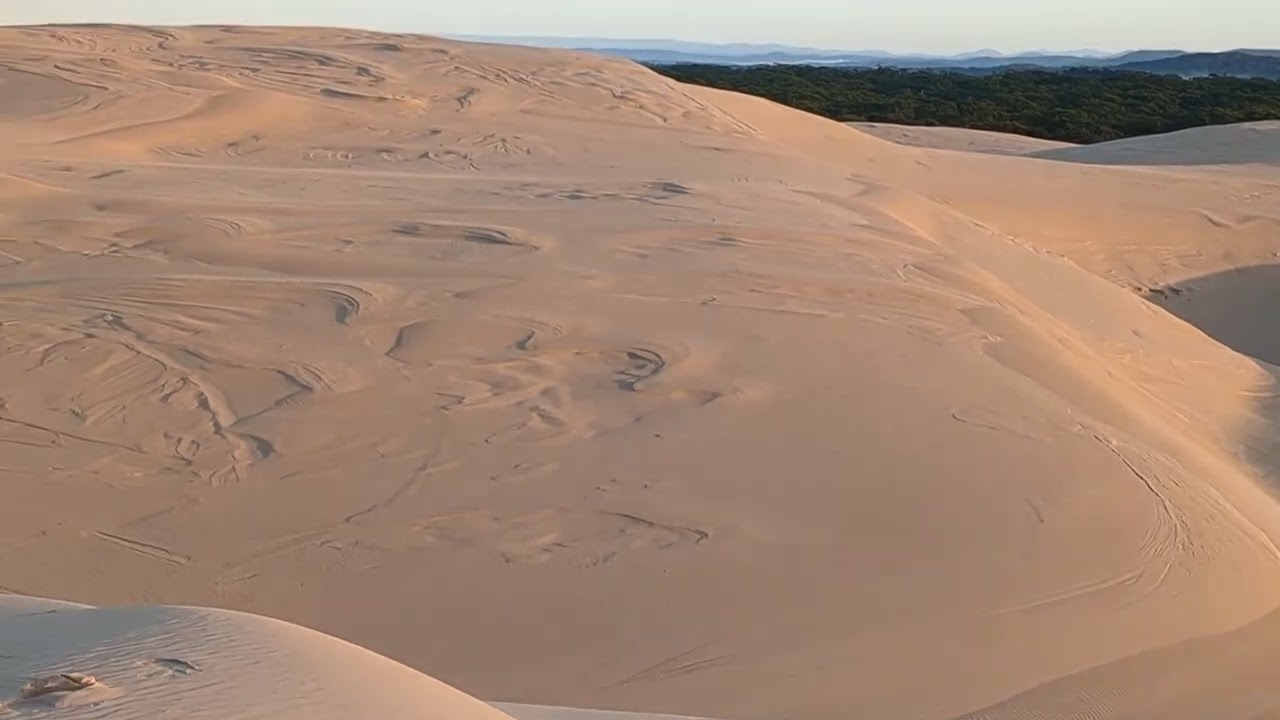 Solo camping in vast sand dunes