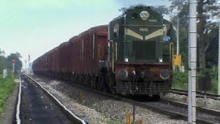 Astounding military UDL WDG-3A dances past gradients with a loaded freight transit