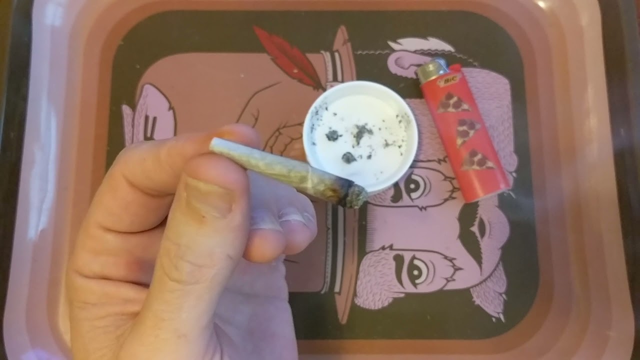 Smoking a joint. London Pound Mints 26% Muv Longwood