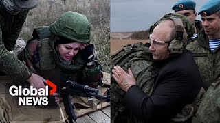 Putin fires sniper rifle on visit with mobilized troops; Russian civilians undergo combat training