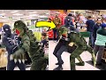Spiderman fights lizard in a store