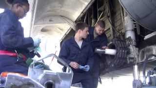 Airmen Repairing C-130 Hercules Cargo Aircraft