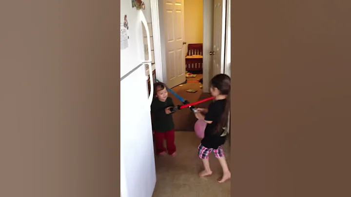 Kids lightsaber battle