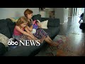 2 young sisters react to their newly adopted baby sister