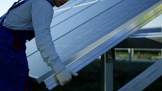 Men Installing a solar panel | Free Stock Video.