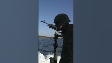 Marines shoot M240B Machine Gun off a MK-III Bridge Erection Boat