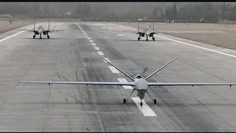 Chinese Air Force holds integration training with fighter jets, armed recon drone