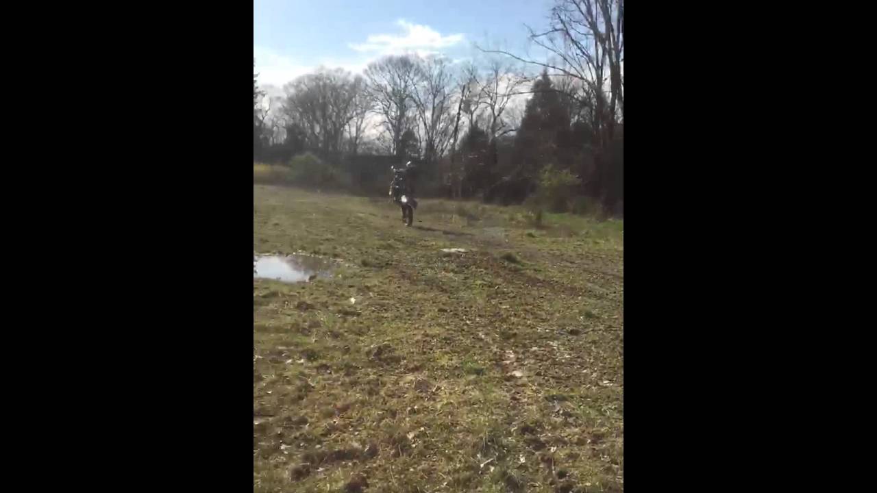 Dirt bike riding wheelie