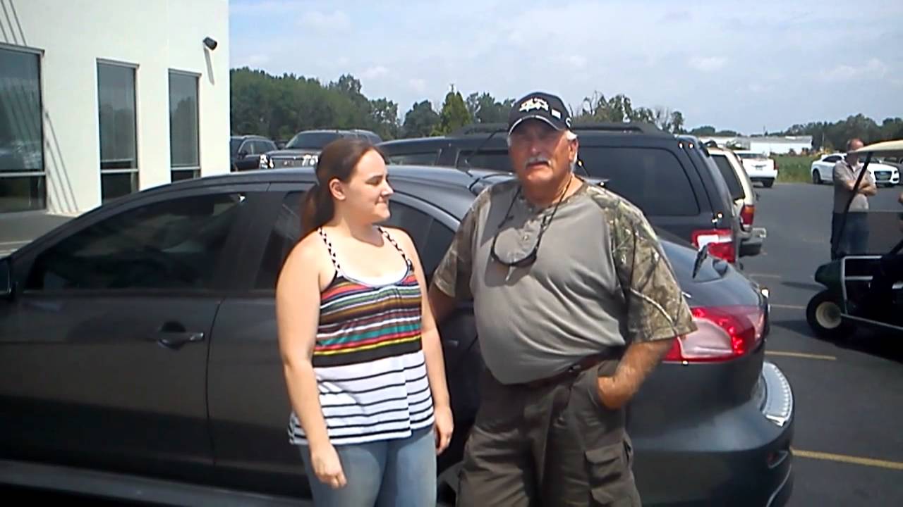 Happy Father and Daughter love their new cars from Ed Schmidt!
