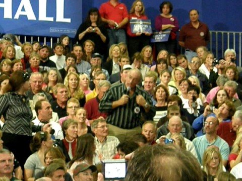 Part of the Angry Man at the Town Hall Meeting in Waukesha Wisconsin 2008. "I'm mad. I'm really mad! And it's not the economy. It's the socialist taking over our country." McCain started to respond, and the man shot back sternly "Let me finish please. When you have Obama, Pelosi, and the rest of the hooligans up there gonna run this country, we've got to have our head examined. It's time that you two are representing us, and we are mad. So go get 'em." Here's a link to photo of the man from the local newspaper: www.jsonline.com