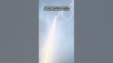 Lightning Bolt Is Guided To Ground Through Rocket Trail