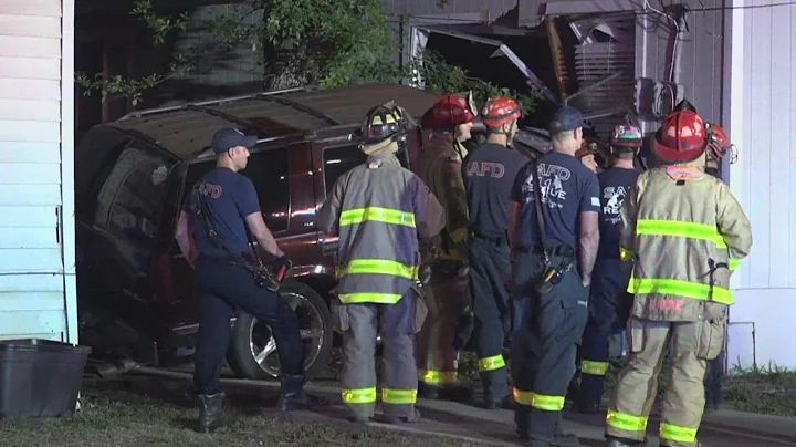 Car crashes into living room with woman, child inside the home, police say
