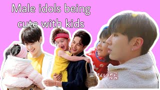 Kpop male idols being cute with kids
