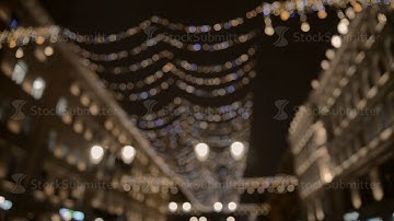 City at night background with cars. Out of focus background with blurry unfocused city lights