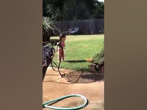 A little girl playing in the sprinkler❤️💦💦