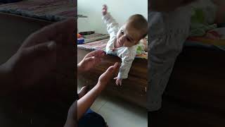 Small Baby Trying To Jump From The Bed