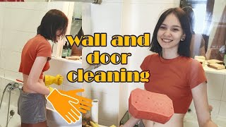 Wall And Door Cleaning With Yellow Rubber Gloves