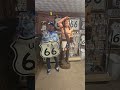 Mike From Champaign Illinois Holds the Original Route 66 Shield in Seligman Arizona