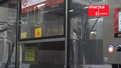 Super high speed laser coding of paper labels for Coke bottles. Up to 70.000 bottles / hour